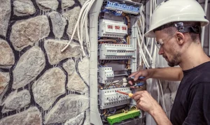 a male electrician works in a switchboard with an 2025 03 13 13 17 21 utc (1)
